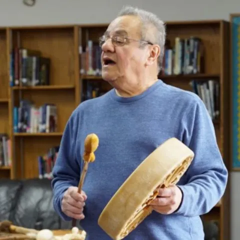 Image of drumming storyteller.