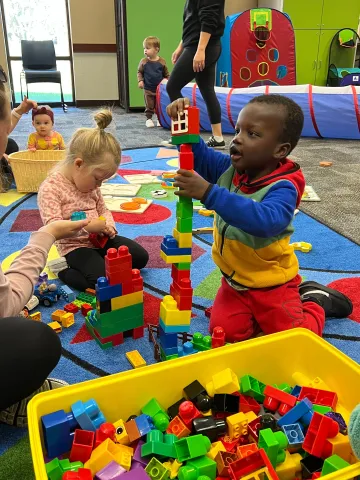Image of kids playing with library toys.