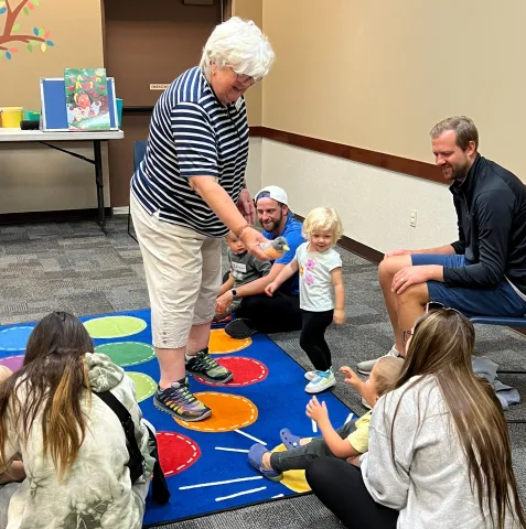 Image of Miss Robin and Toddler Time kids.
