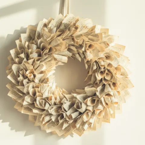 A wreath with leaves made out of rolled book pages