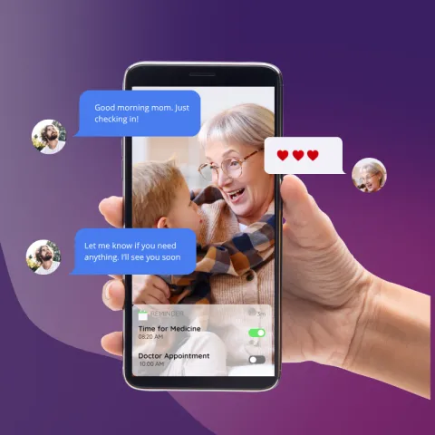 A smartphone displays a conversation between two people. A son says "good morning mom. Just checking in!" The woman responds with three red hearts. The son sends another message: "Let me know if you need anything. I'll see you soon."  In the background are notifications reminding about a Doctor Appointment and taking medication.