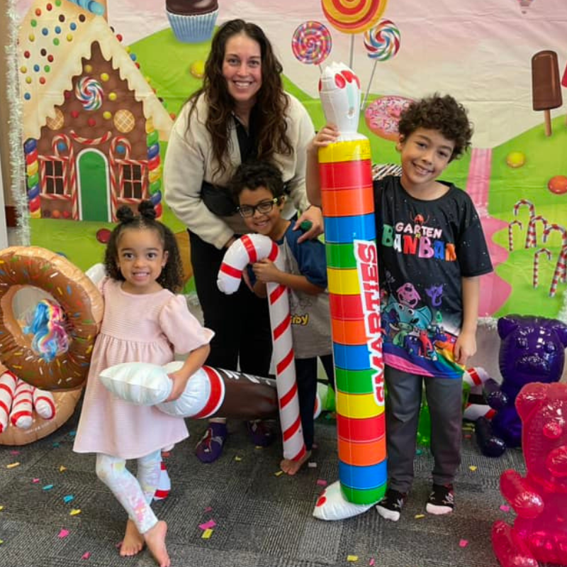 Image of family holding inflatable candy.